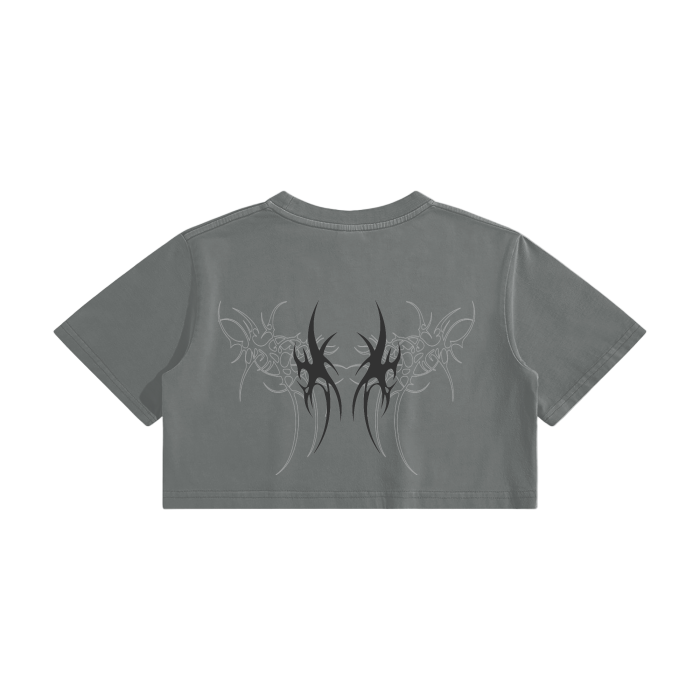 Gray crop top with black tribal design on the back against a white background